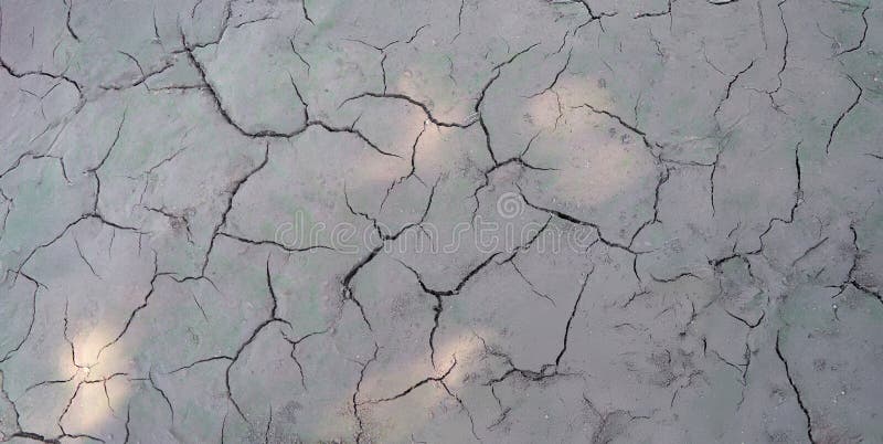 Sun Beams on Dry Cracked Gray Ground Shadow Close up Stock Photo Sun Beams on Dry Cracked Gray Ground Shadow Close up Stock Photo