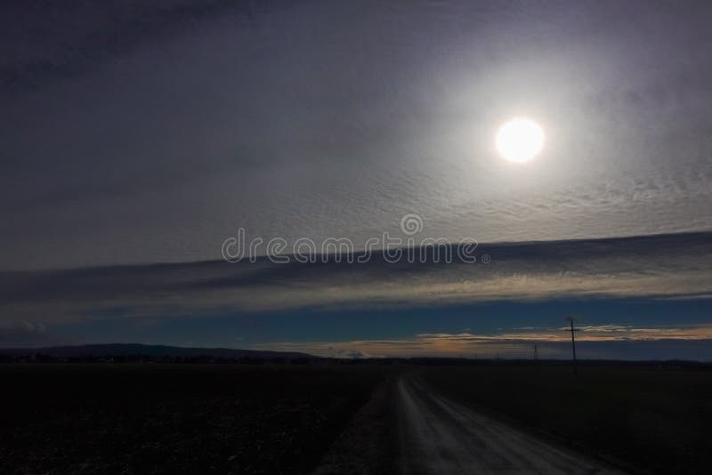 Sun Behind Wonderful White Clouds in a Landscape Stock Image Image of