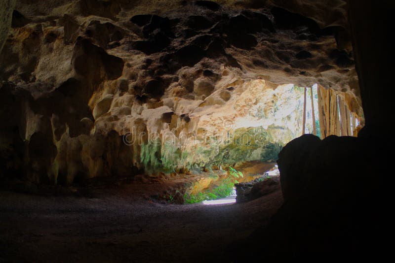 Soft glow from the sun shines on the mouth of the Crystal Cave entrance in Grand Cayman. Soft glow from the sun shines on the mouth of the Crystal Cave entrance in Grand Cayman.