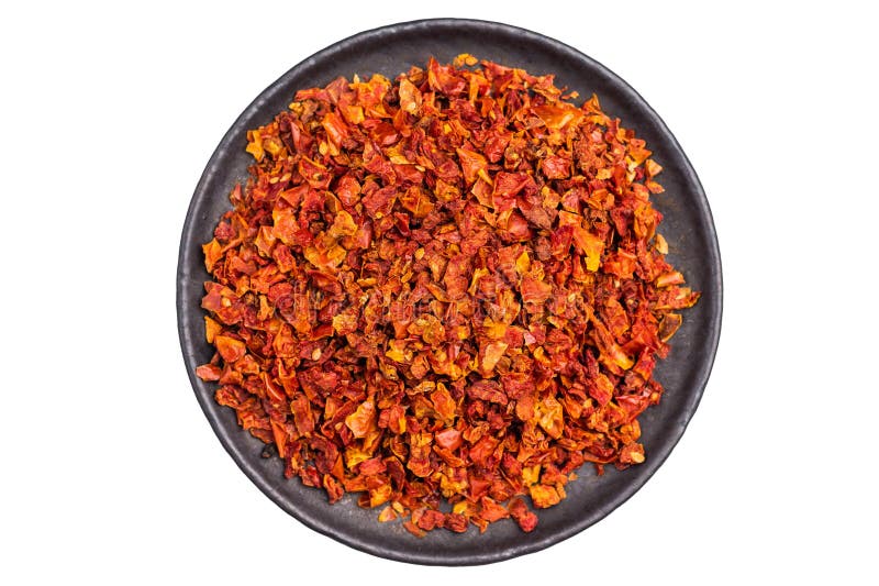 Sun dried tomato flakes isolated on white background top view fotografia stock