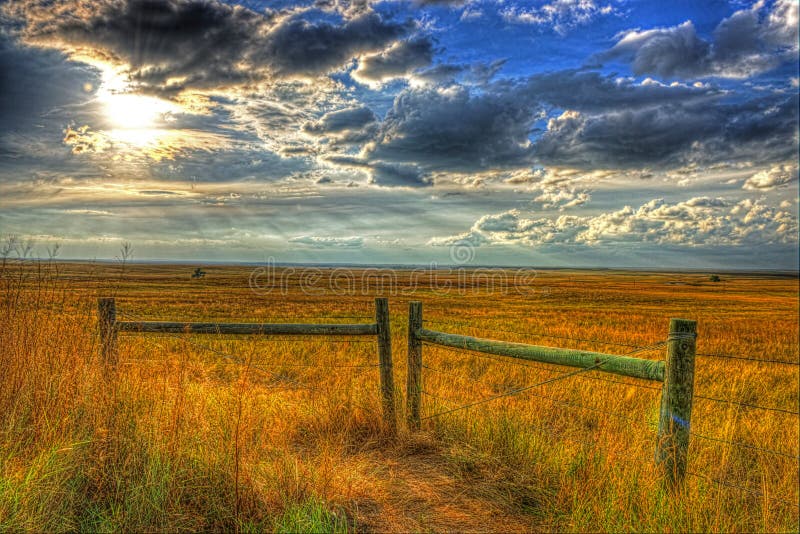 Sun lowering in the late afternoon skies over the midwestern plains HDR