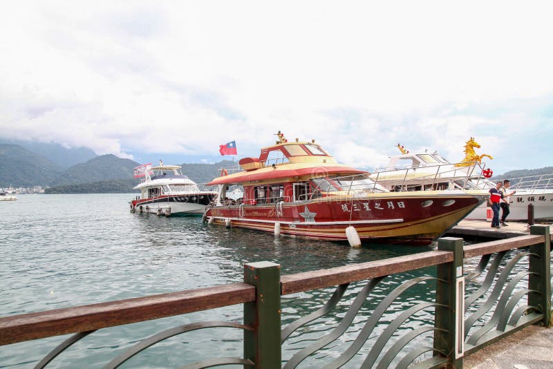 Sun moon lake ,Taiwan-October 13,2018:The ferry speed boat at the Sun Moon Lake harbour .Tourist are used to ferry passengers to 3 stock photos Sun moon lake ,Taiwan-October 13,2018:The ferry speed boat at the Sun Moon Lake harbour .Tourist are used to ferry passengers to 3 stock photos
