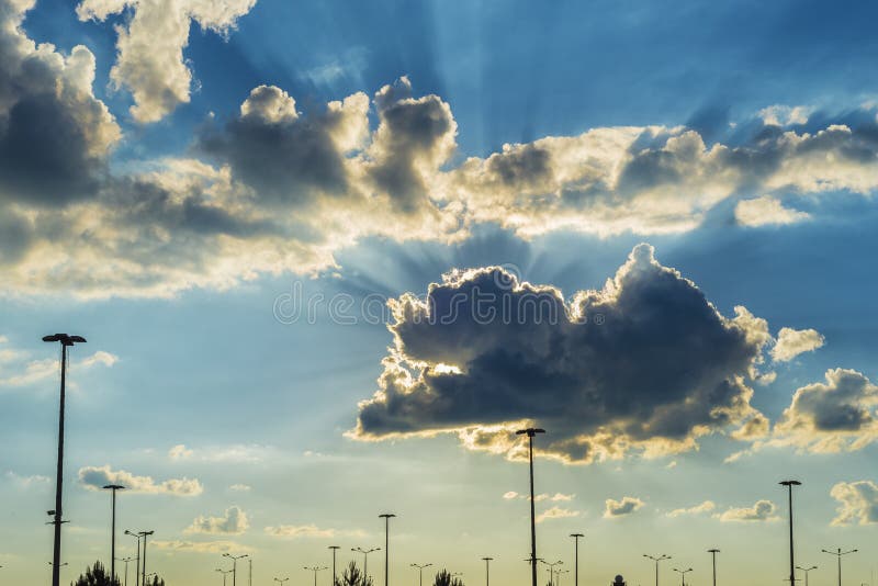 Breaking Through The Clouds 2 Sun Rays Breaking through Clouds on a Dramatic Sky Stock Image - Image