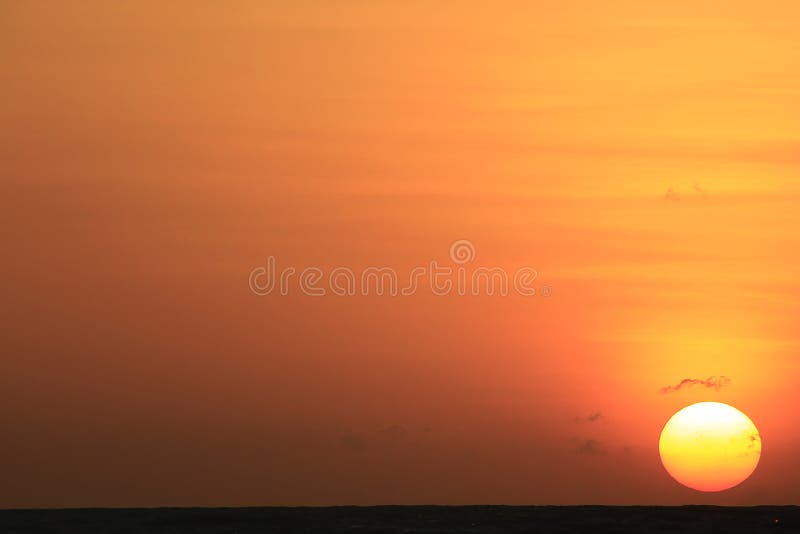 The sun is rising in the morning from the sea. stock photo The sun is rising in the morning from the sea. stock photo