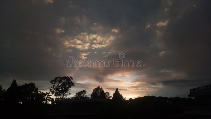 Sun set clouds reflection by sun-rays