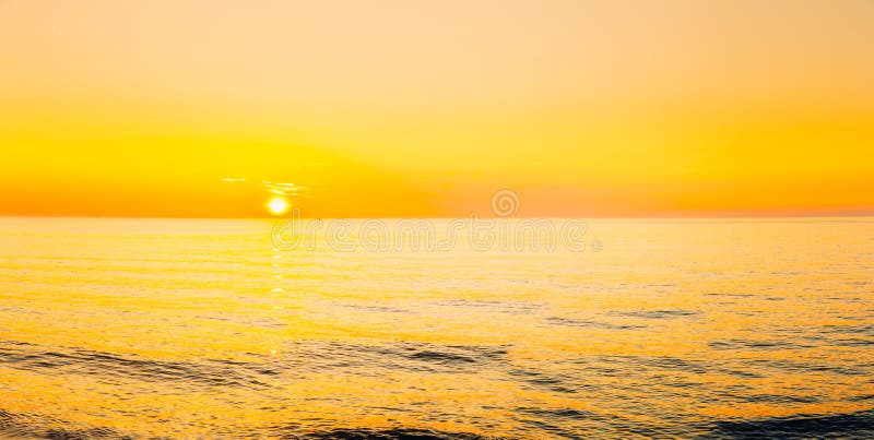Sun is Setting on Horizon at Sunset Sunrise Over Sea or Ocean. Stock ...