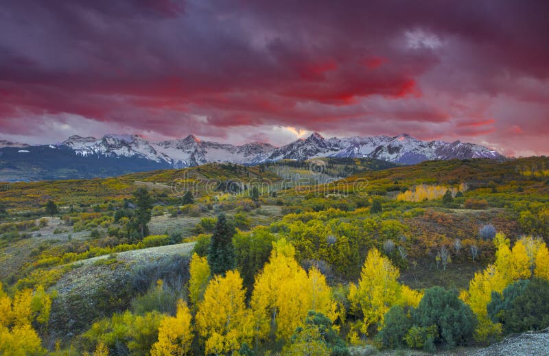 Sun setting over San Juan Mountain range and Autumn Fall color of the Dallas Divide Ridgway, Colorado, America stock photos Sun setting over San Juan Mountain range and Autumn Fall color of the Dallas Divide Ridgway, Colorado, America stock photos