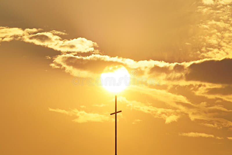Beautiful sunset through the clouds with cross catholic royalty free stock photography Beautiful sunset through the clouds with cross catholic royalty free stock photography