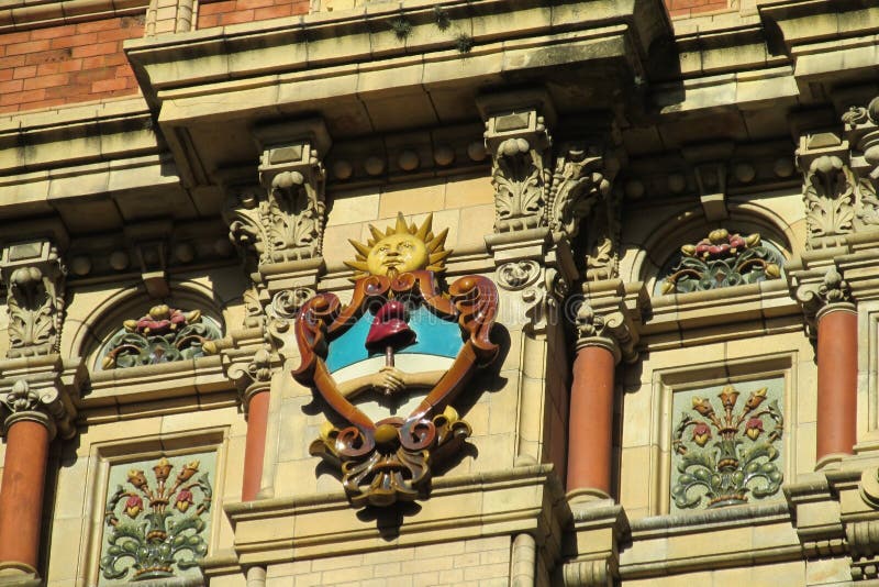 Sun symbol on the building wall on Palacio de Aguas Corrientes in Buenos Aires, The Water Company Palace. The Palace of Flowing Waters an architecturally significant water pumping station in Buenos Aires, Argentina. Symbols of the sun on the walls. Sun symbol on the building wall on Palacio de Aguas Corrientes in Buenos Aires, The Water Company Palace. The Palace of Flowing Waters an architecturally significant water pumping station in Buenos Aires, Argentina. Symbols of the sun on the walls