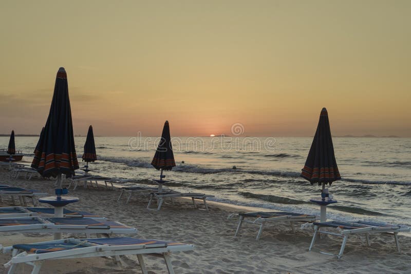 Sun Umbrellas and Hammocks on the Beach a Sunset Stock Photo Image of
