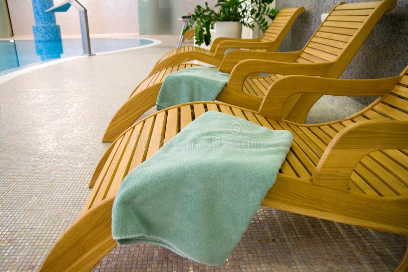 Sunbeds in the fitness with turquoise towel