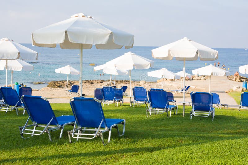 Sunbeds and Umbrellas on Public Beach in Paphos, Cyprus Stock Image ...