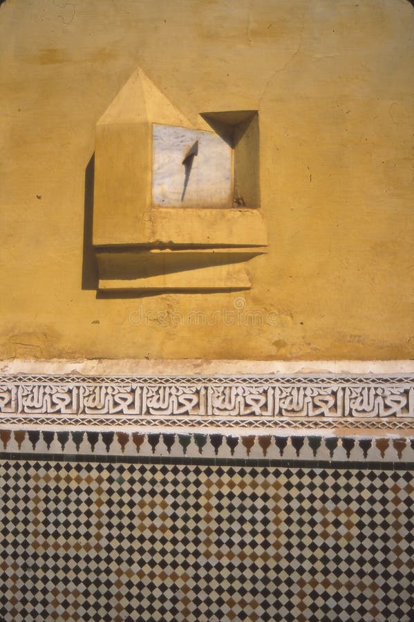 Sundial in courtyard wall