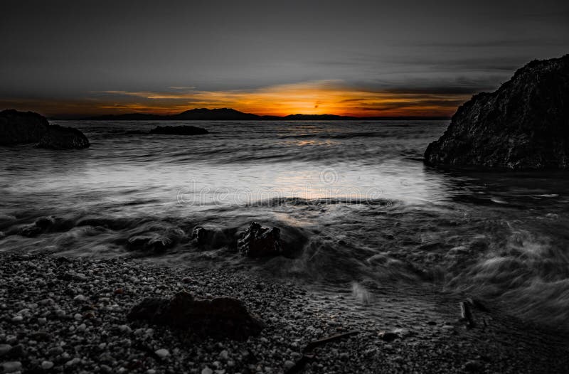 Sundowner at the Beach stock photo. Image of stones 273655408