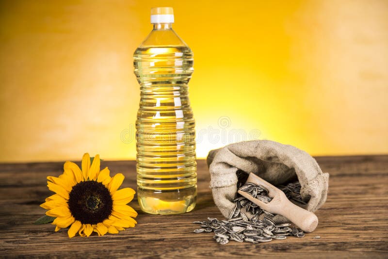 Sunflower Oil in a Bottle and Sunflower Seeds and Sunflower Stock Photo