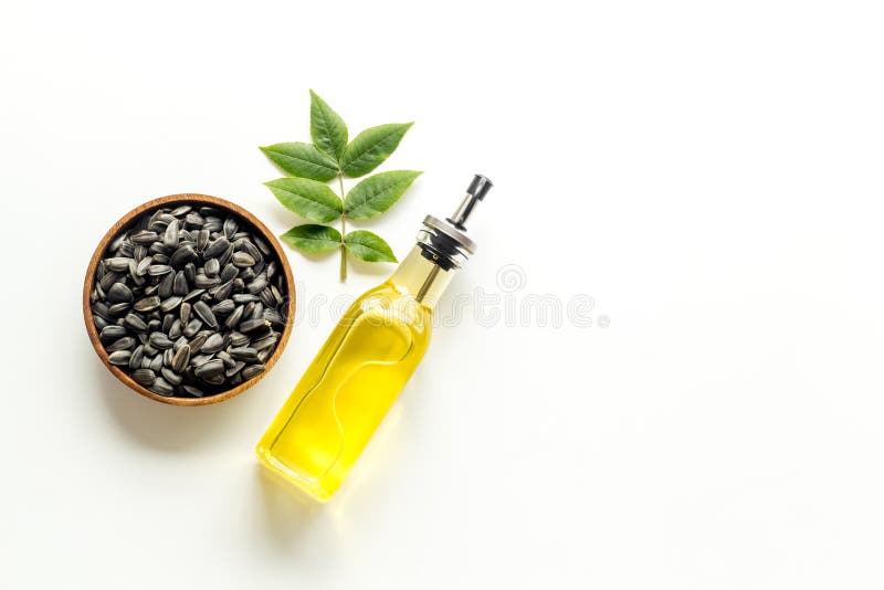 Sunflower Oil in Bottle with Seeds. Cooking Oil Background Stock Photo
