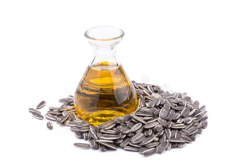 Sunflower oil in glass bottle and sun-flower seed isolated on white background stock photos Sunflower oil in glass bottle and sun-flower seed isolated on white background stock photos
