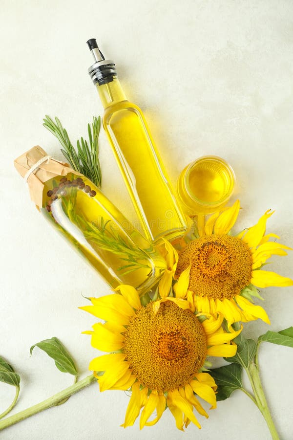 Sunflower Oil and Ingredients on White Textured Table Stock Image