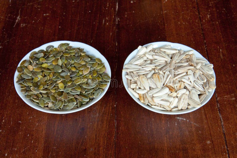 Sunflower and Pumpkin Seeds Stock Photo Image of seeds, wooden 22027474