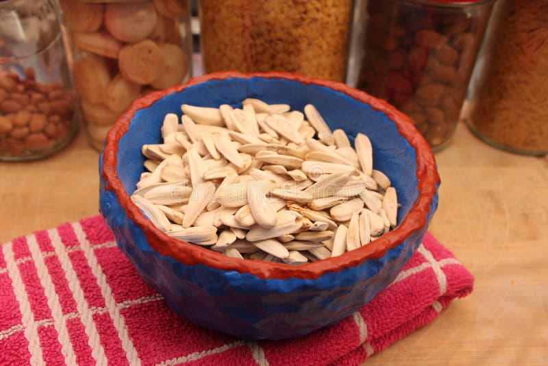 Sunflower seeds in a bowl stock photo. Image of seeds 244089414