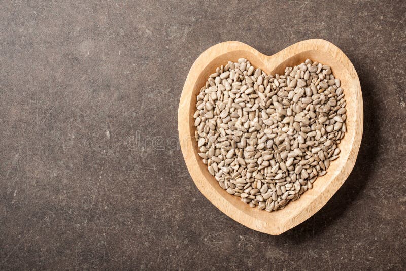 Sunflower Seeds in Heart Shaped Bowl Stock Image Image of wooden