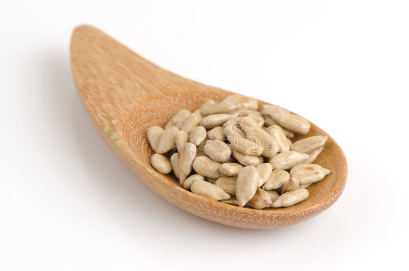 Sunflower seeds on a wooden spoon