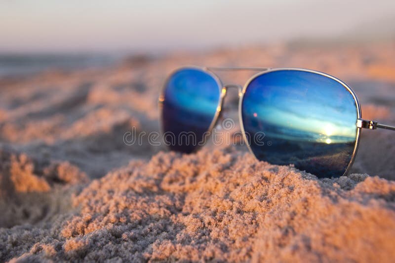 Sunglasses at the beach stock photo. Image of ocean, seashore 57333102