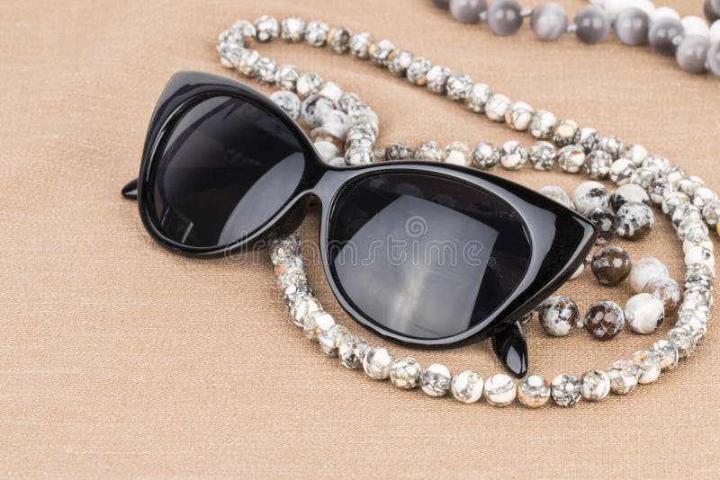 Sunglasses and beads. stock image. Image of gemstone 55815473