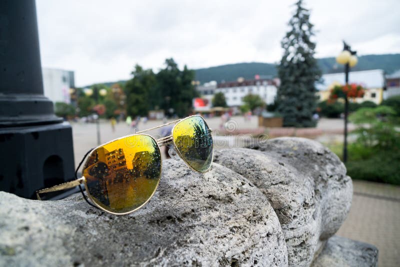 Sunglasses in town during rain. Slovakia