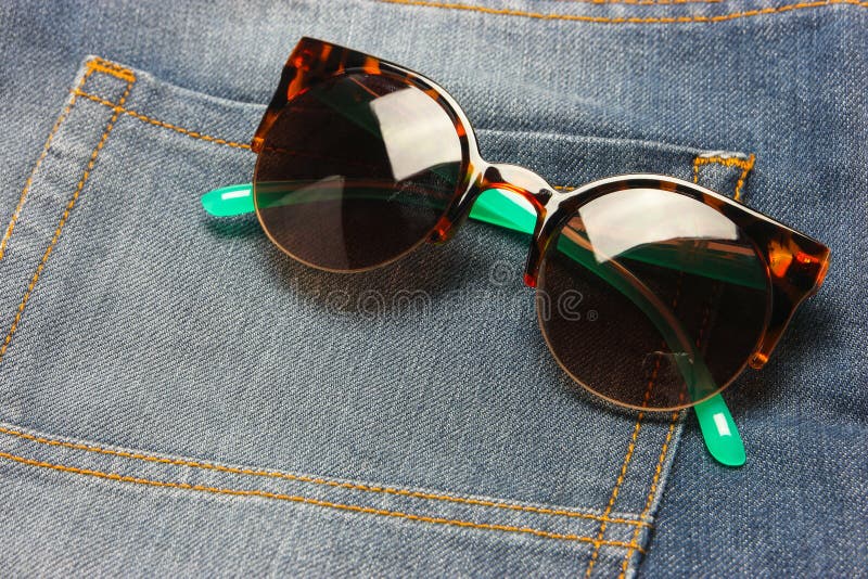 Sunglasses with jeans. stock photo. Image of denim, indigo 74318308