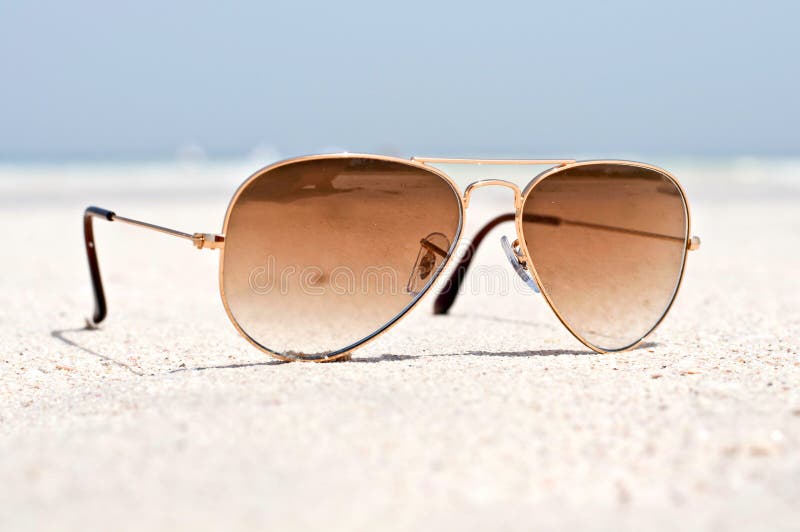 Sunglasses on a sand beach stock image. Image of sunglasses 41844291