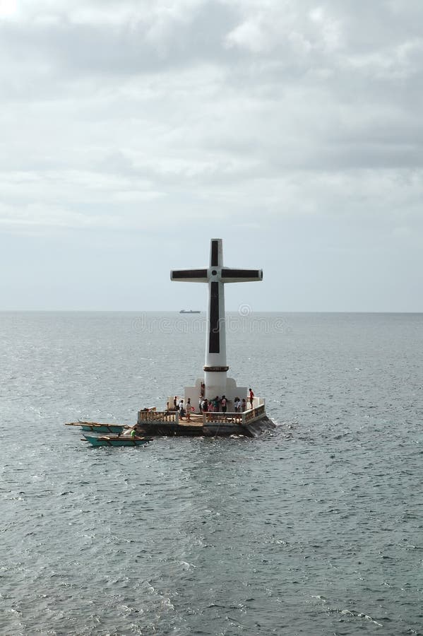 Sunken cemetery cross monument in Camiguin, Philippines