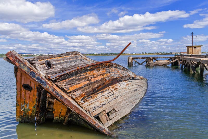 Sunken wooden ship in Seixal Bay (Tagus River),near Lisbon. Portugal.