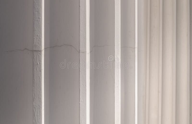 Sunlight shines passing through light channel of exterior of the concrete white walls background royalty free stock images