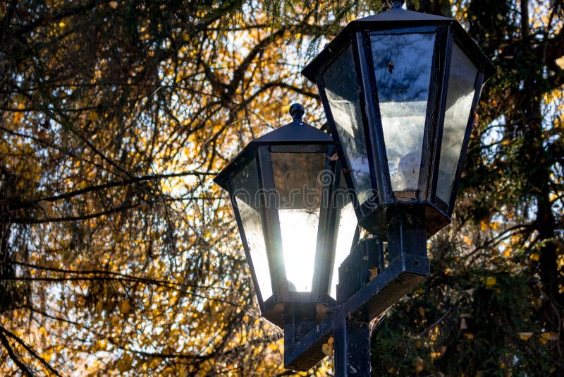 Sunlight Shines through a Street Lamp during the Day Stock Image