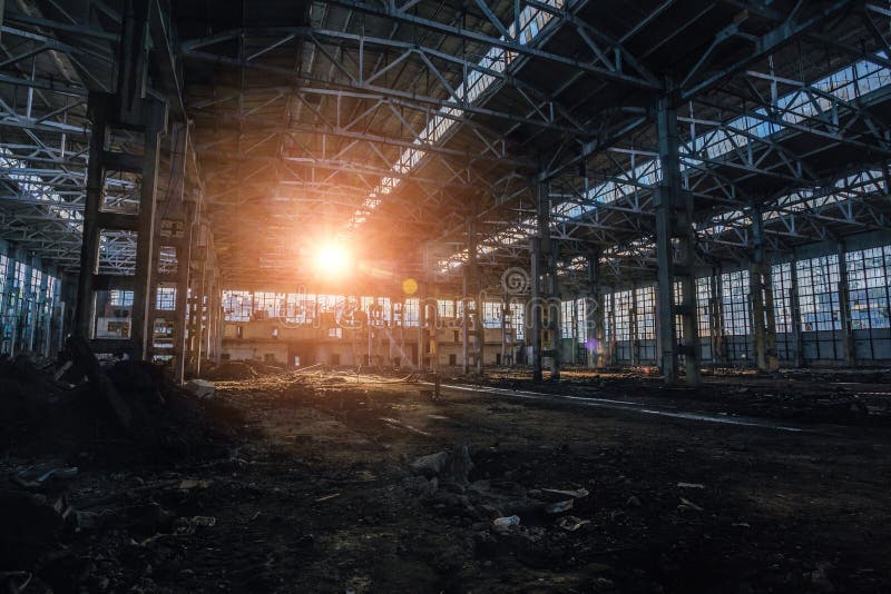 Sunlight of sunset in large abandoned industrial building of Voronezh excavator factory stock image Sunlight of sunset in large abandoned industrial building of Voronezh excavator factory stock image