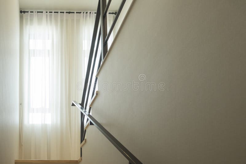 Sunlight from window. Curtain and railing in home. royalty free stock photography
