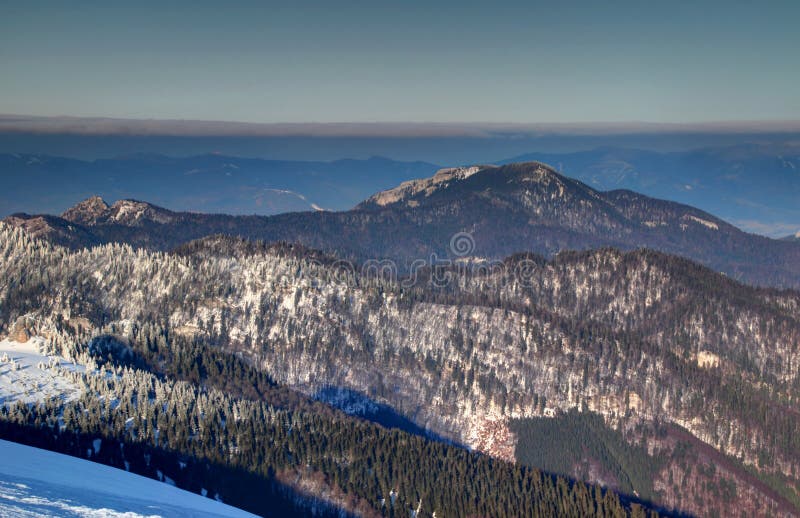 Sunlit snowy ridges and craggy peaks of Velka Fatra Slovakia