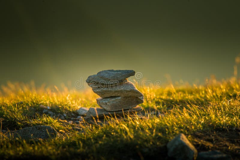 Sunlit stack of rocks in sunset