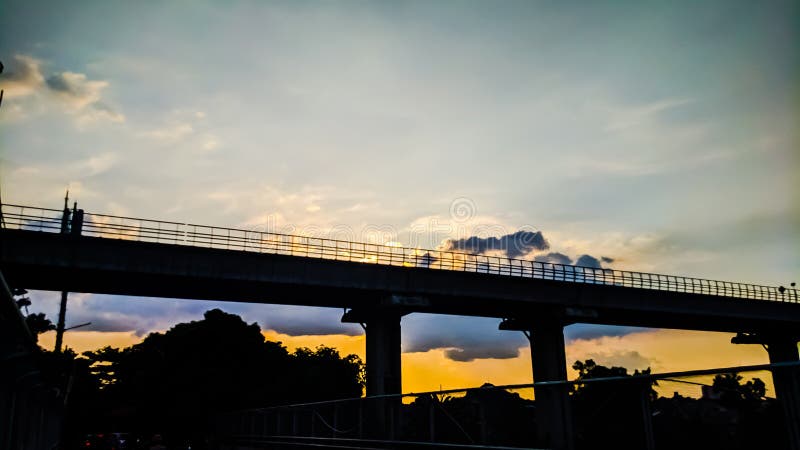 Sunny Afternoon and the Silhouette of the Flyover Stock Photo - Image ...