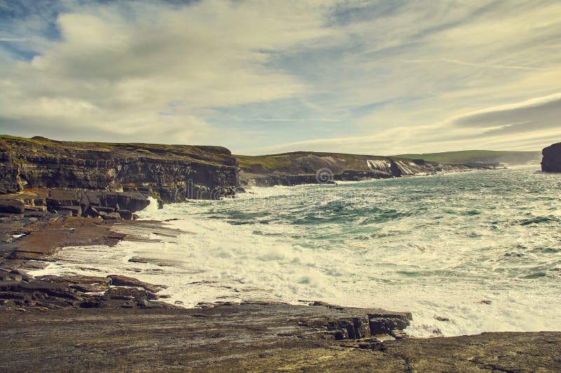 Sunny Cliffs of Kilkee in Ireland county Clare. Tourist destination stock photo Sunny Cliffs of Kilkee in Ireland county Clare. Tourist destination stock photo