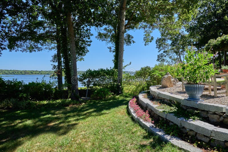 Sunny Patio and Garden by the River Stock Image Image of trees, grass