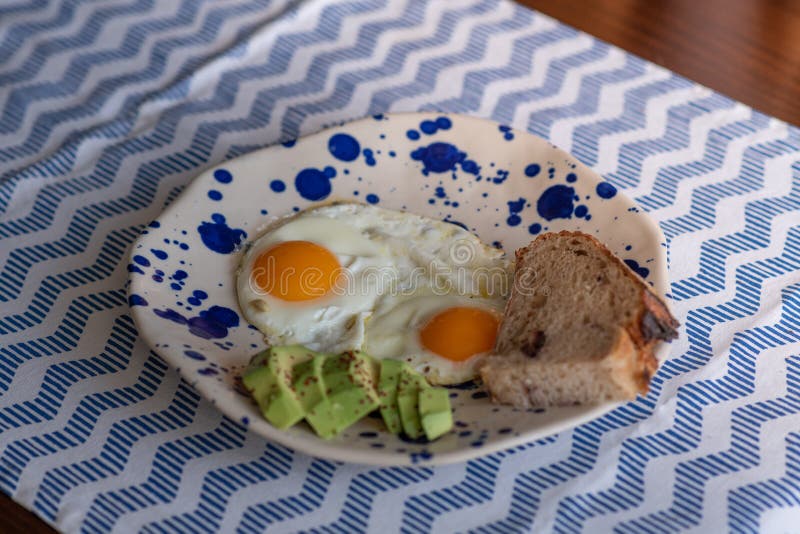 Sunny Side Up Eggs with Sliced Avocado Stock Photo Image of avocado