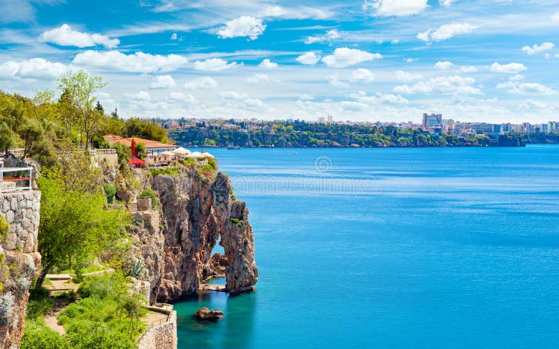 Rocky shore, blue sky and clear sea in Antalya, Turkey stock image Rocky shore, blue sky and clear sea in Antalya, Turkey stock image