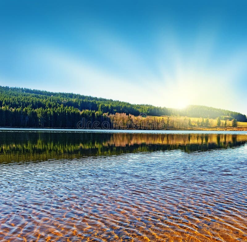 Sunrise above lake stock photo. Image of sunbeams, river - 21549364