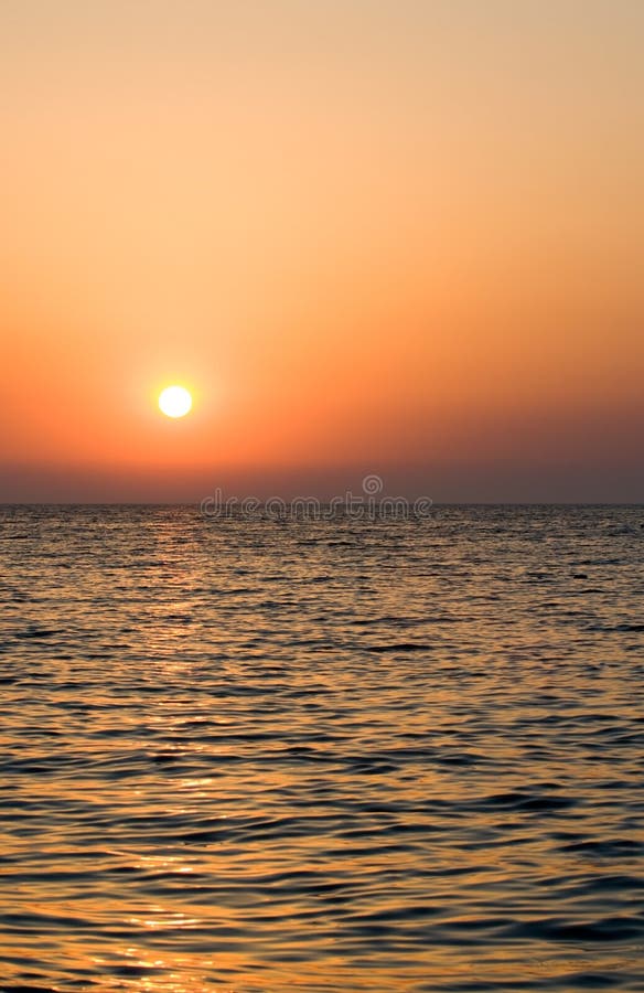 Sunrise above the sea stock image. Image of side, rest - 6027825