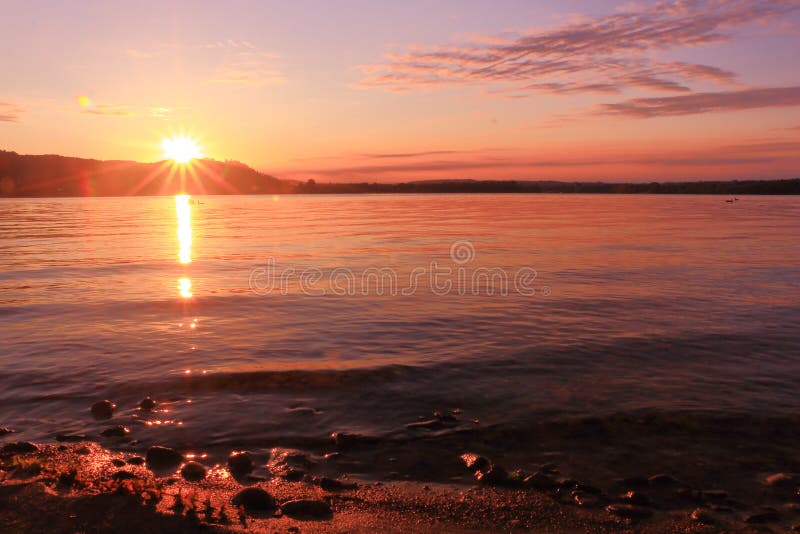 Sunrise by a lake inspiring relax and quietness