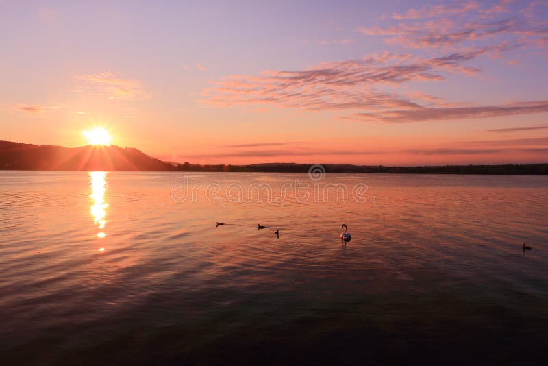 Sunrise by a lake inspiring relax and quietness