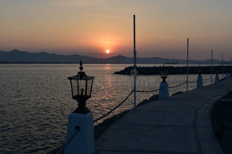 Sunrise at Las Hadas Marina and Resort. A lantern lit pathway with fishing boats. Manzanillo, Colima, Mexico.