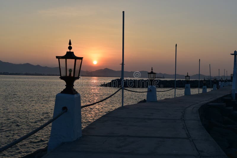 Sunrise at Las Hadas Marina and Resort. A lantern lit pathway with fishing boats. Manzanillo, Colima, Mexico.